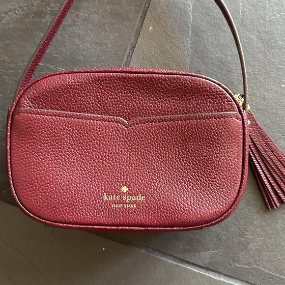 Kate Spade purse.  Used one time.  Maroon/ reddish leather.  Camera bag style. - Picture 4 of 9